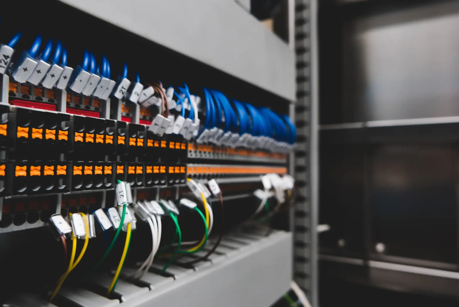Close-up of labeled wiring and terminal blocks in an electrical panel