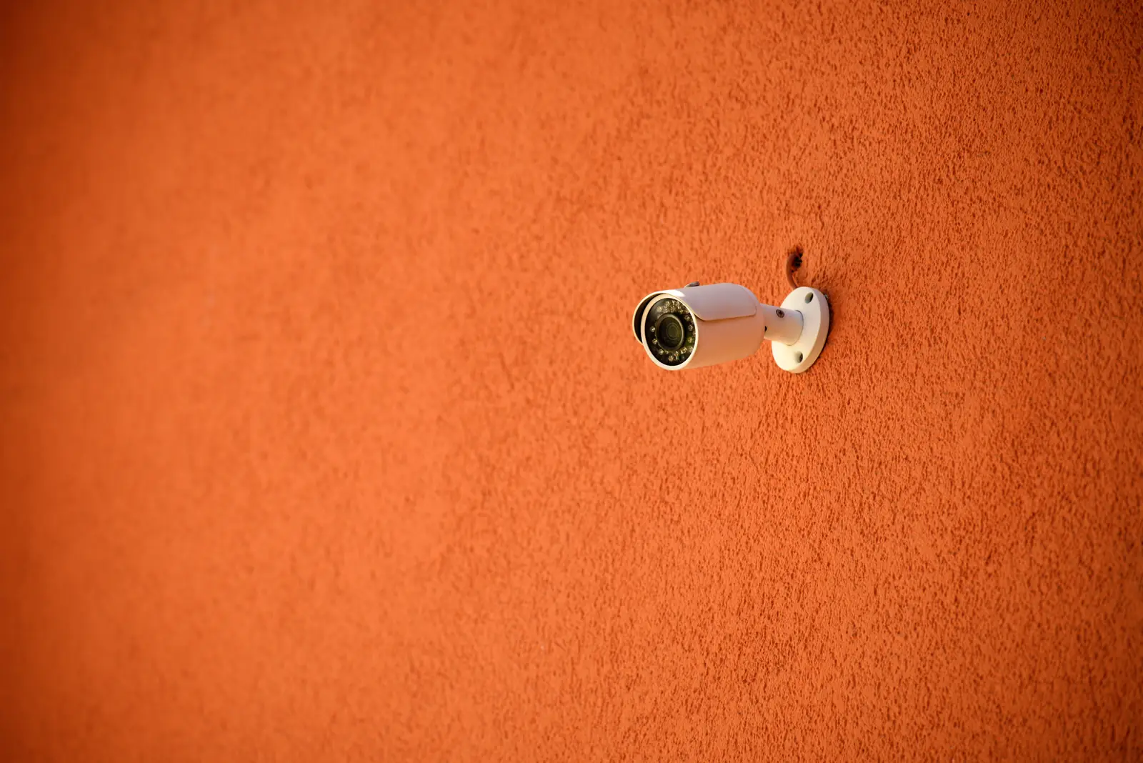 Security camera mounted on an exterior wall